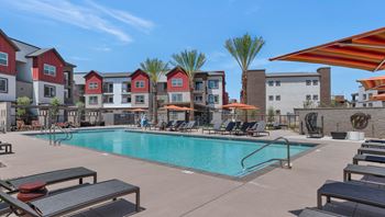 Our apartments have a swimming pool with lounge chairs and umbrellas